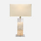 Table lamp with a beige shade and marble base on a white background