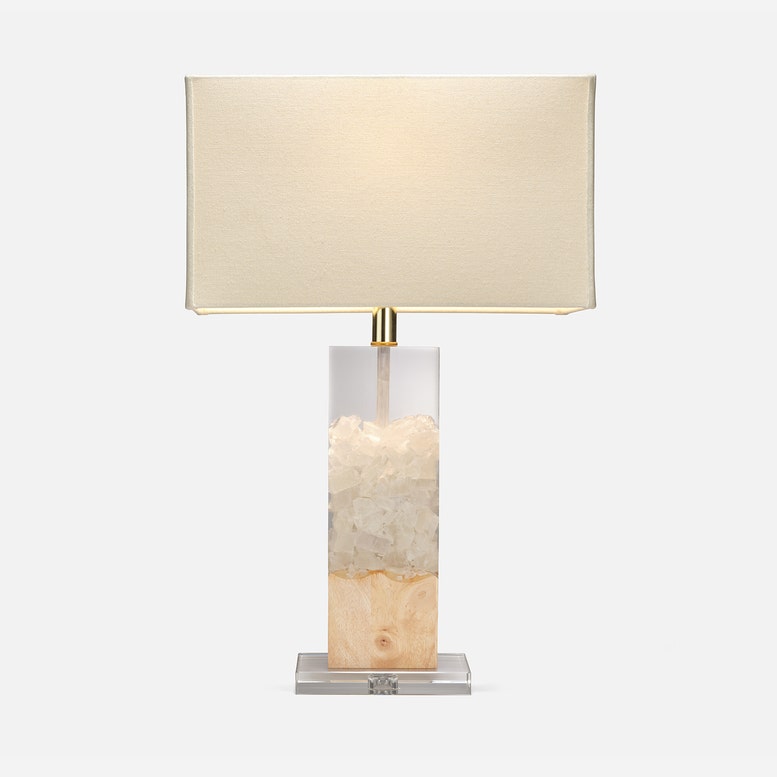 Table lamp with a beige shade and marble base on a white background