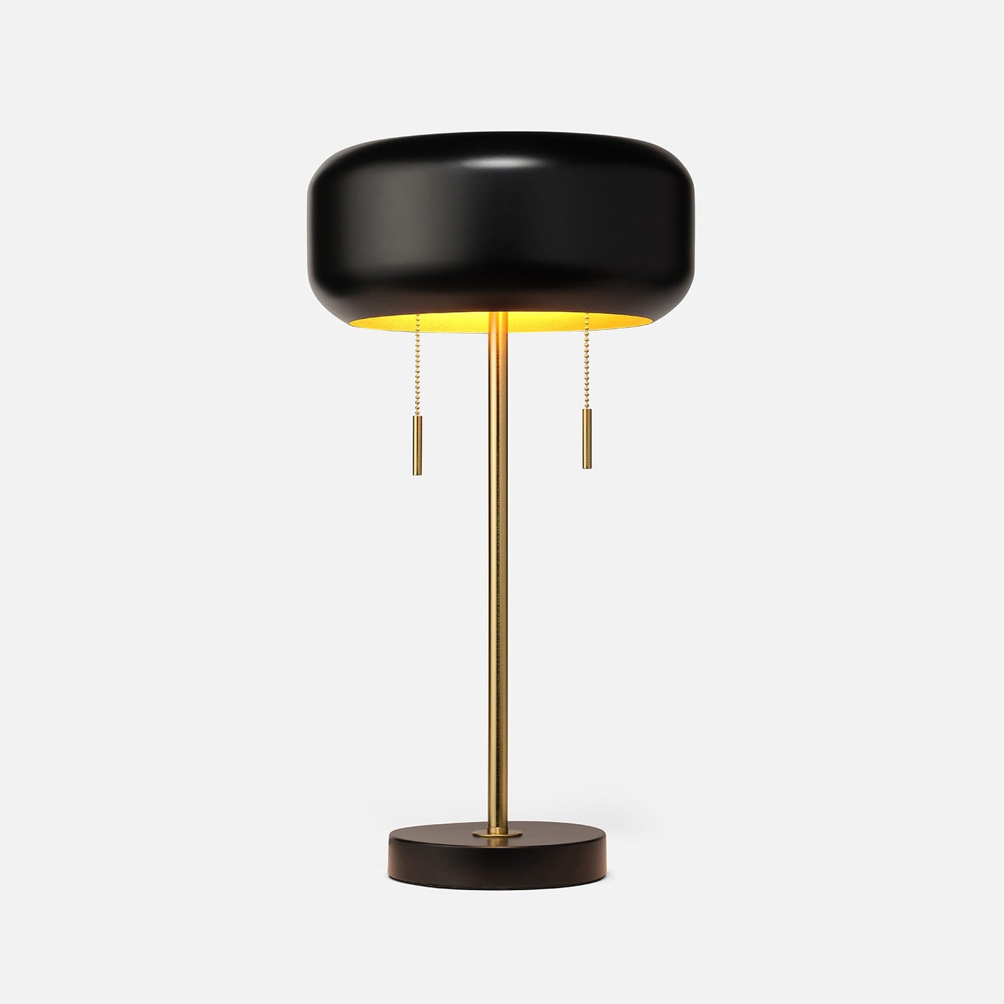 Modern black and gold table lamp on a white background