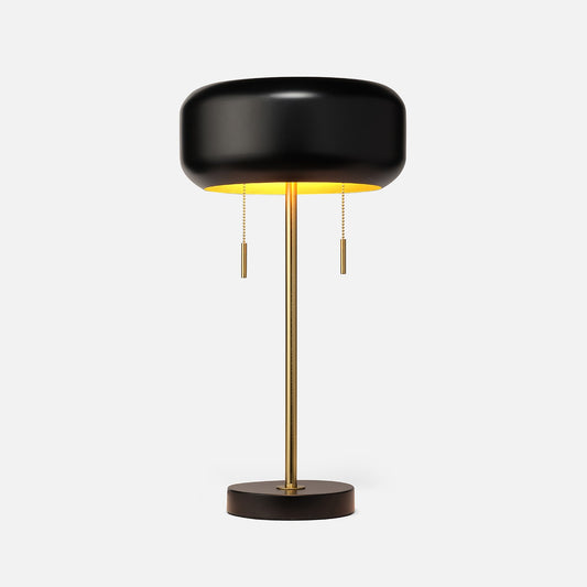 Modern black and gold table lamp on a white background