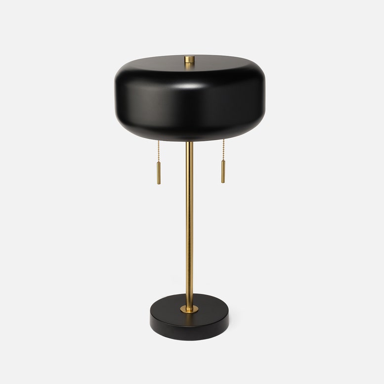Black and gold table lamp on a white background
