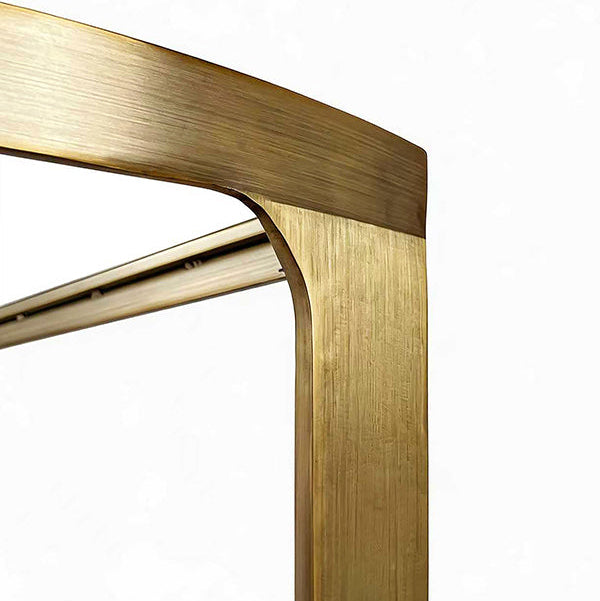Close-up of a gold metal frame with a white background
