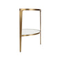 Small round table with gold metal frame and white glass top on a white background