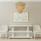 Modern living room with a white console table, chairs, and decorative items.