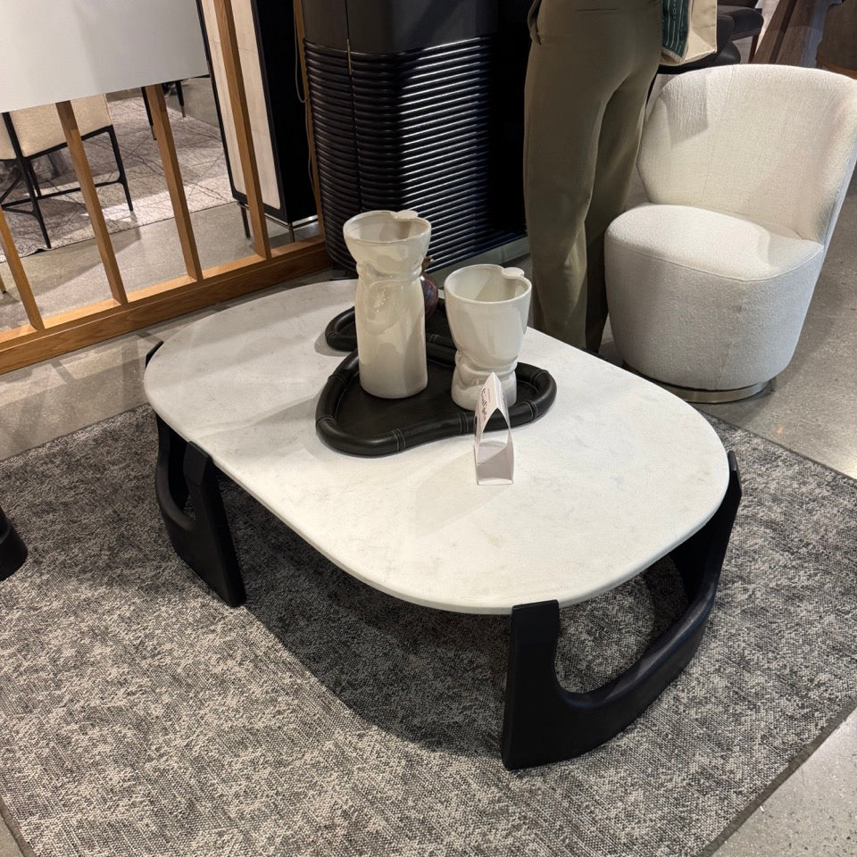 Modern coffee table with decorative items in a room setting