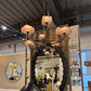 Chandelier displayed in a showroom with mirrors and furniture.