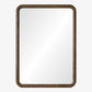 A rectangular wall mirror with a thick, rounded brown wooden frame, shown against a plain light gray background.