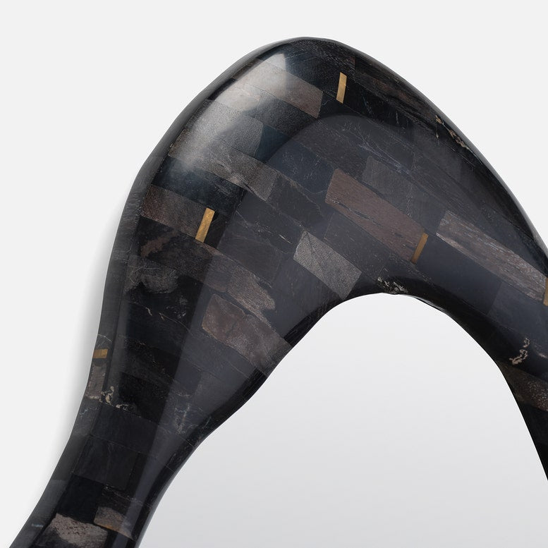 Close-up of a black and gray patterned object on a white background