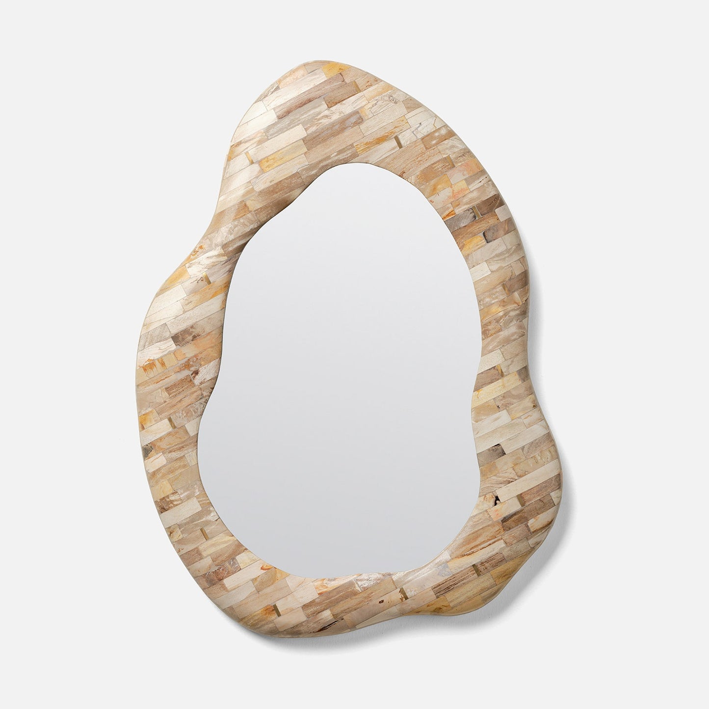 Decorative mirror with a unique, organic-shaped frame on a white background