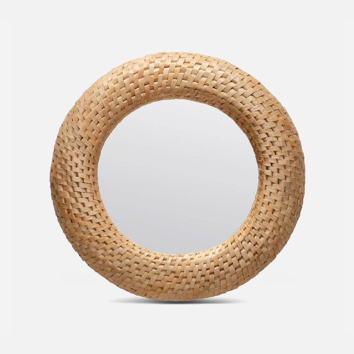 Round mirror with a woven natural wood frame on a light gray background