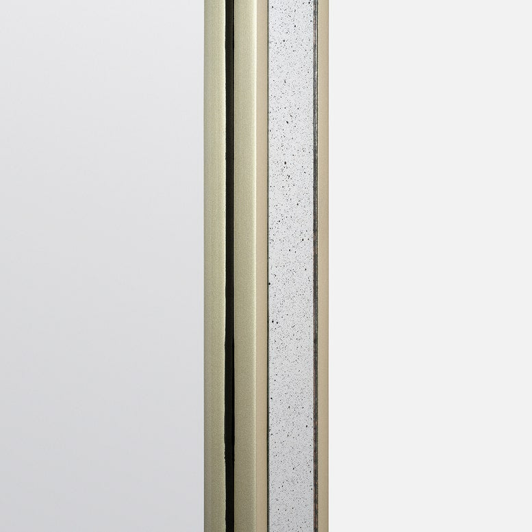 Close-up of a metallic frame with speckled texture on a light gray background