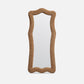 Rectangular mirror with a wicker frame on a white background