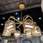 Gold chandelier with crystal-like design in a room setting