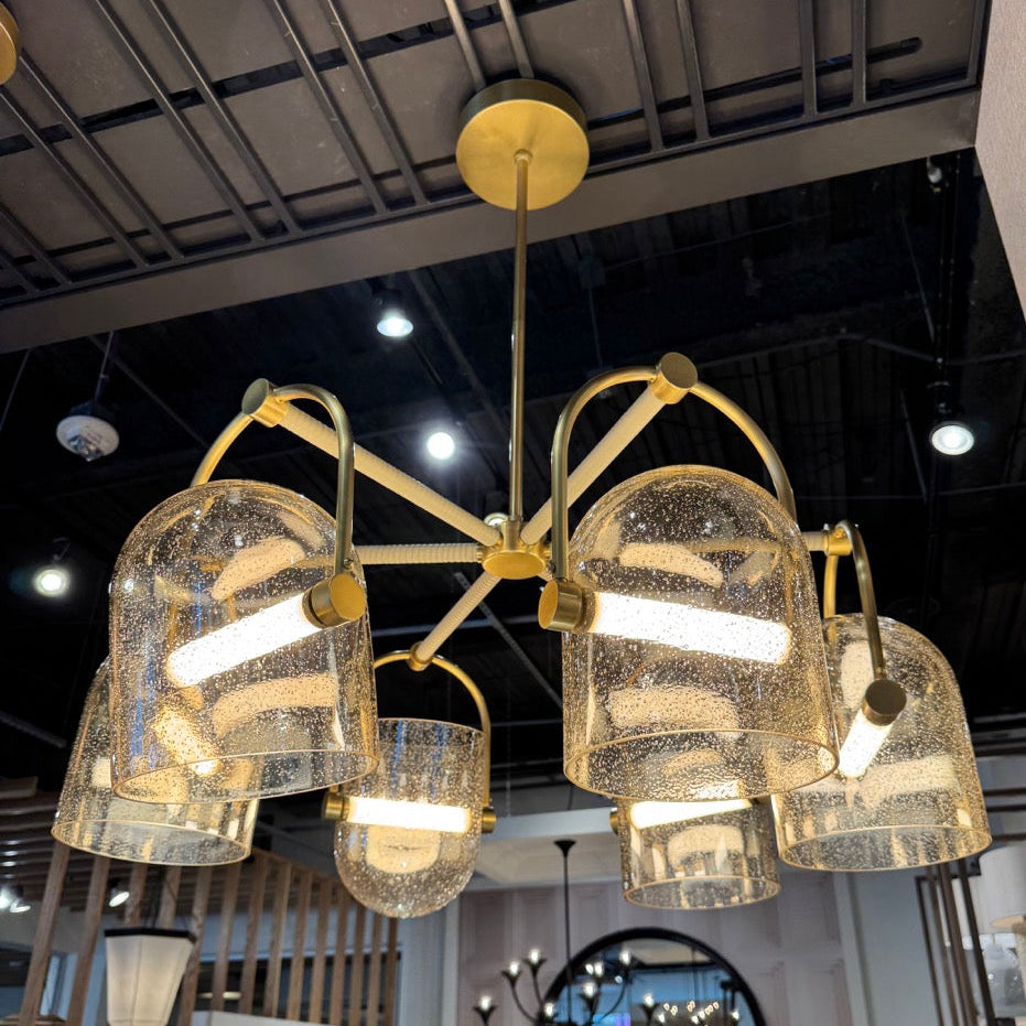 Gold chandelier with crystal-like design in a room setting