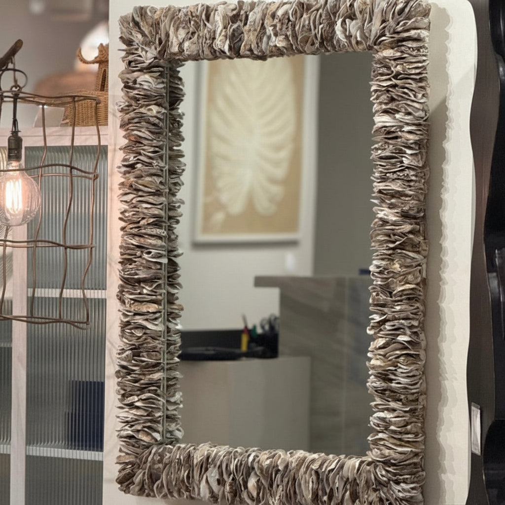 Decorative mirror with a textured frame in a room setting