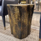 aluminum side table with a textured surface in an indoor setting
