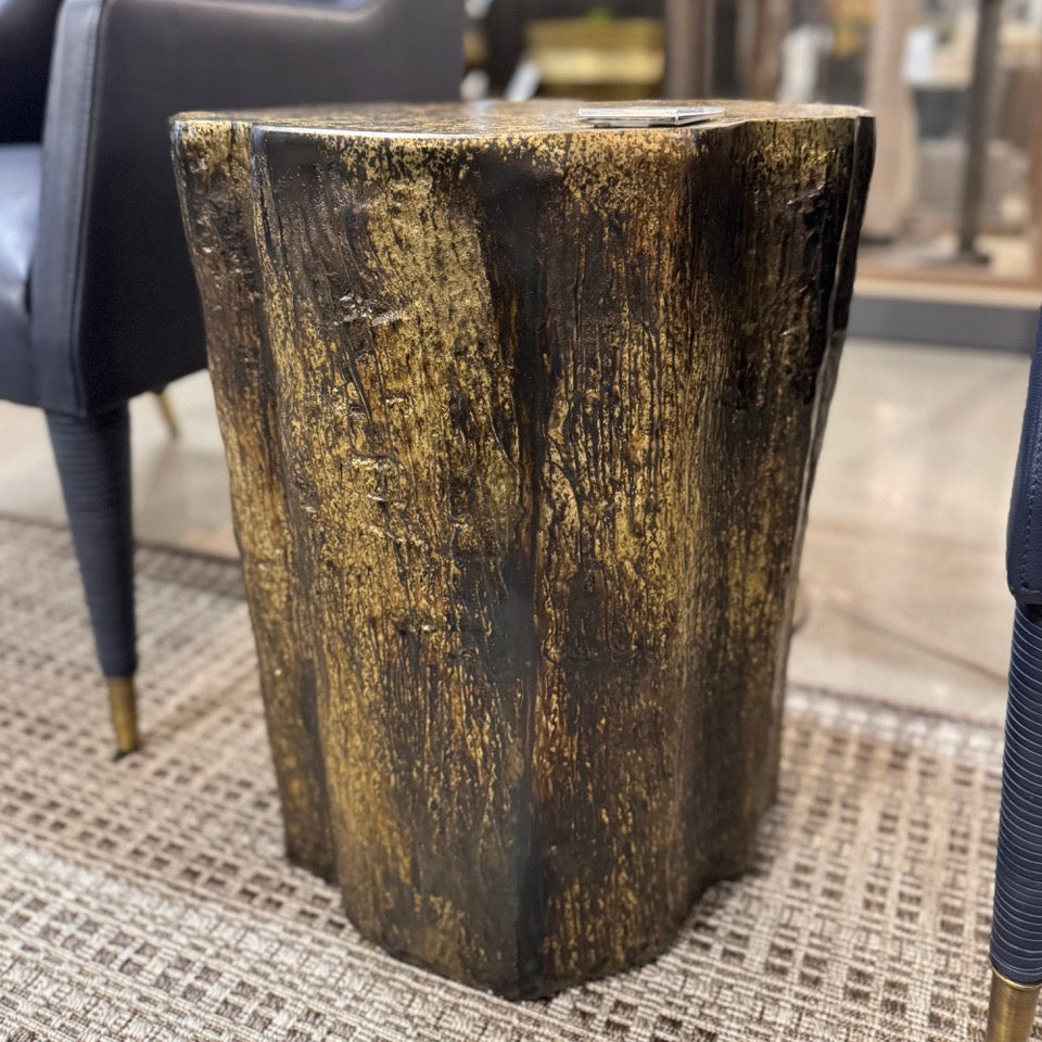 aluminum side table with a textured surface in an indoor setting