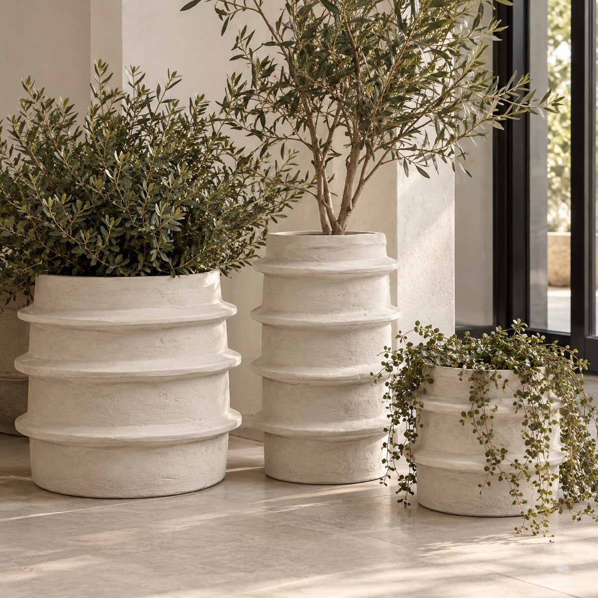 Molly Pot 03 styled, 18inches in height styled with other similar pots in a modern entryway of a home
