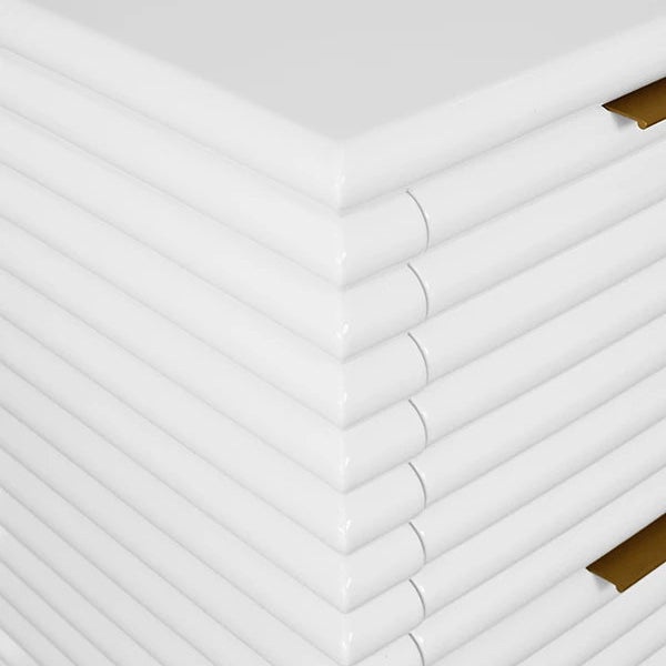 White nightstand with gold accents on a white background