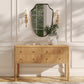 Wooden console table with a mirror and decorative items in a stylish room.
