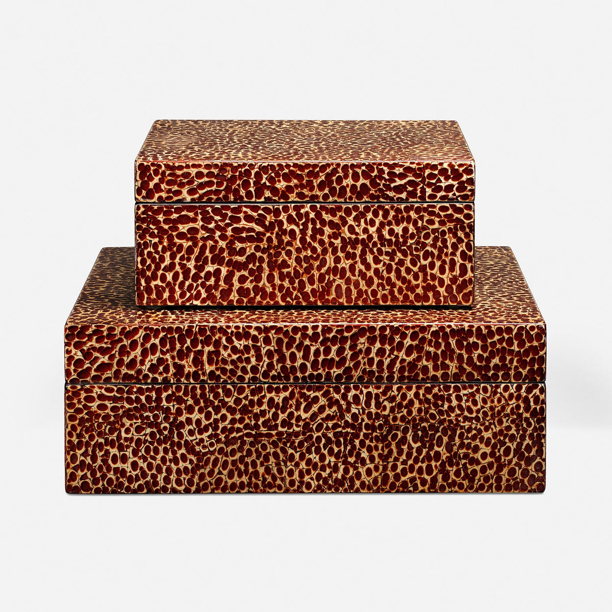 two stacked rectangular storage boxes with a textured brown and beige animal-print pattern, photographed against a clean white background.