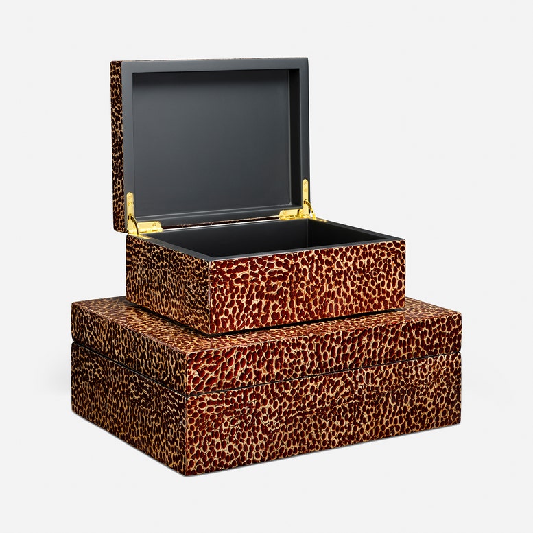 A set of two stacked rectangular storage boxes with a brown and black leopard print pattern, featuring gold-tone metal hinges and an open top box with a dark interior, shown on a light gray background.