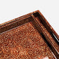 Close-up of a rectangular tray with a glossy leopard print pattern in brown, tan, and black, shown on a light gray background.