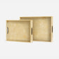 Two rectangular serving trays with textured, pebbled beige interiors and dark oval cutouts in the sides, shown on a clean white background.