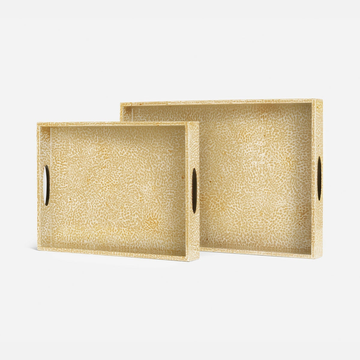 Two rectangular serving trays with textured, pebbled beige interiors and dark oval cutouts in the sides, shown on a clean white background.