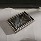 Decorative tray with geometric pattern on a gray surface