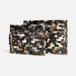 Two rectangular trays with handles, featuring a mosaic tile pattern in black, brown, beige, and white, displayed on a light gray background.