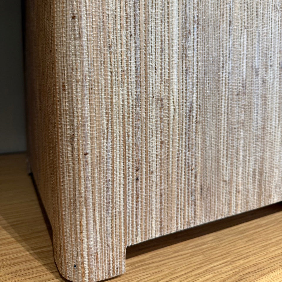 Close-up of a textured cylindrical object on a wooden surface