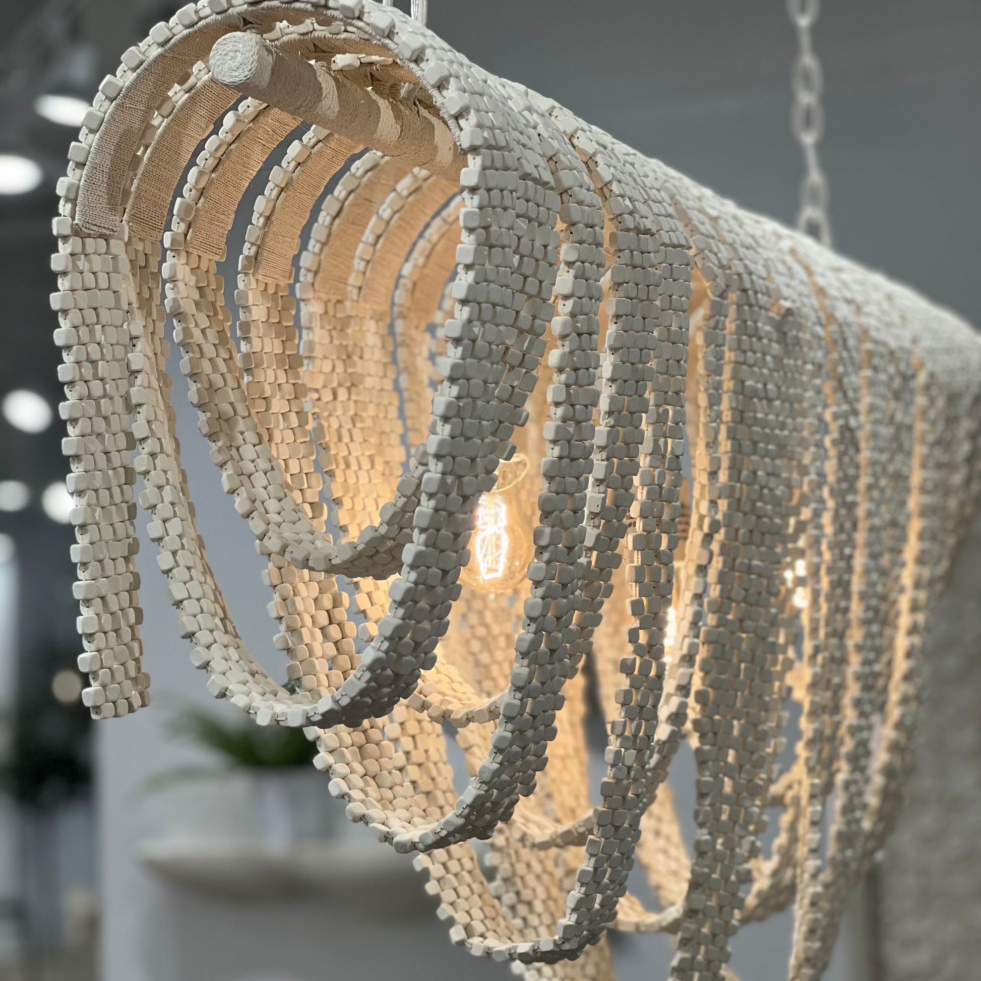 Decorative chandelier with a textured design in a room setting