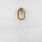 Gold door handle on a white textured surface