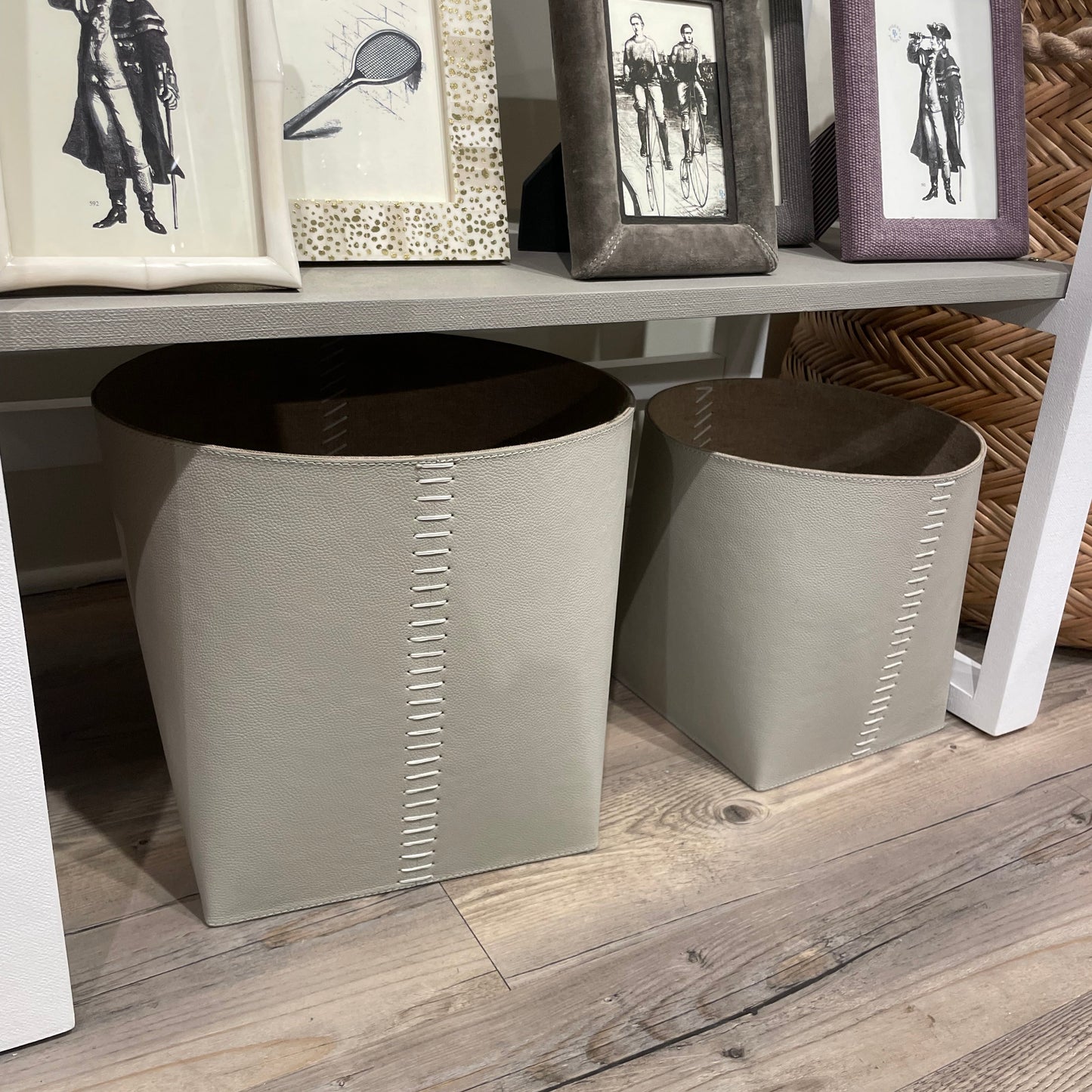 Gray stools with decorative frames on a wooden floor