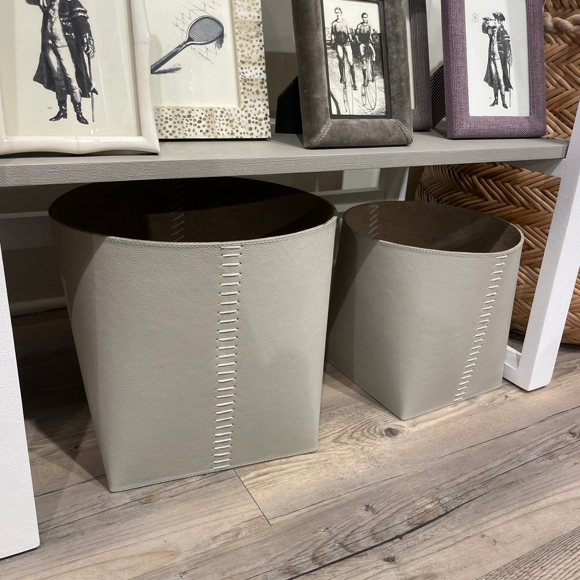 Gray stools with decorative frames on a wooden floor