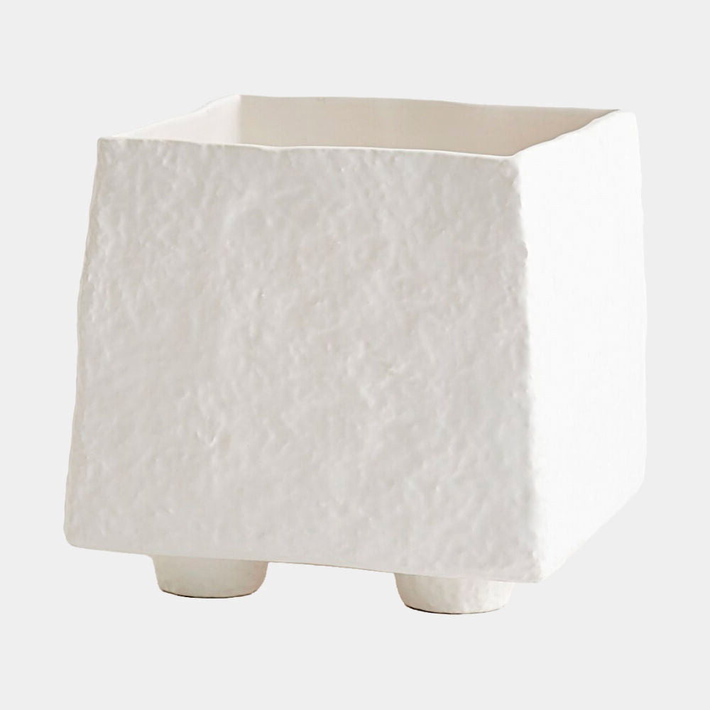 A square white textured ceramic planter with a rough, organic surface finish and small cylindrical feet, shown on a light gray background.