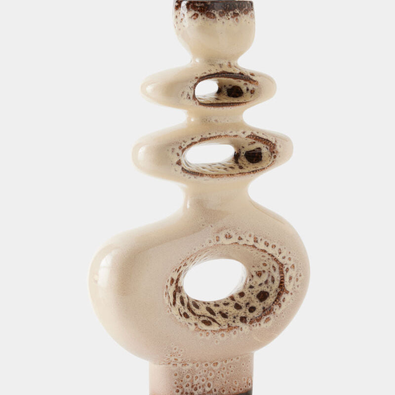Ceramic vase with textured surface on a white background