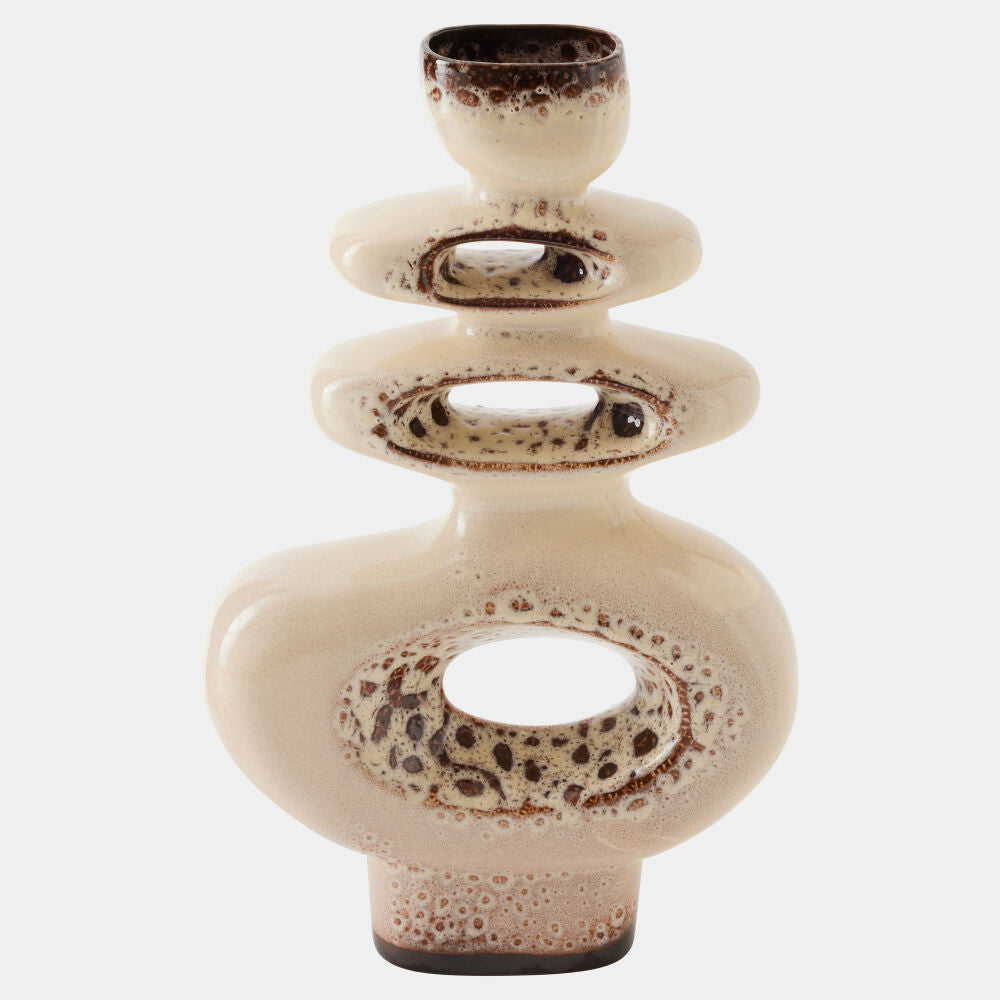 Ceramic vase with a textured design on a white background