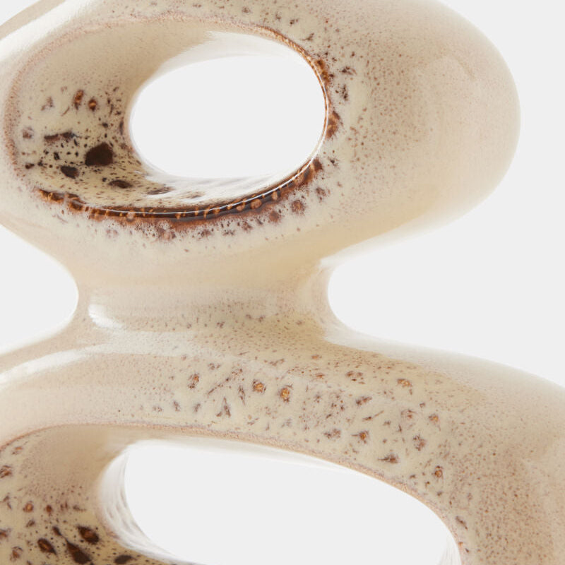 Close-up of a creamy beverage with a swirling pattern on a white background