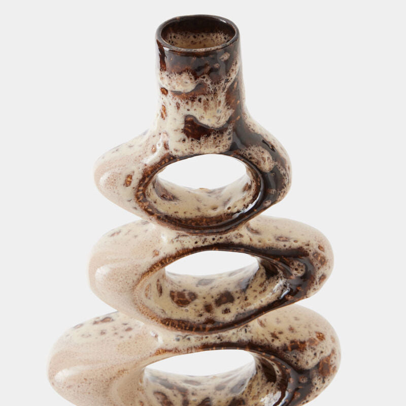 Ceramic spiral vase with brown speckles on a white background
