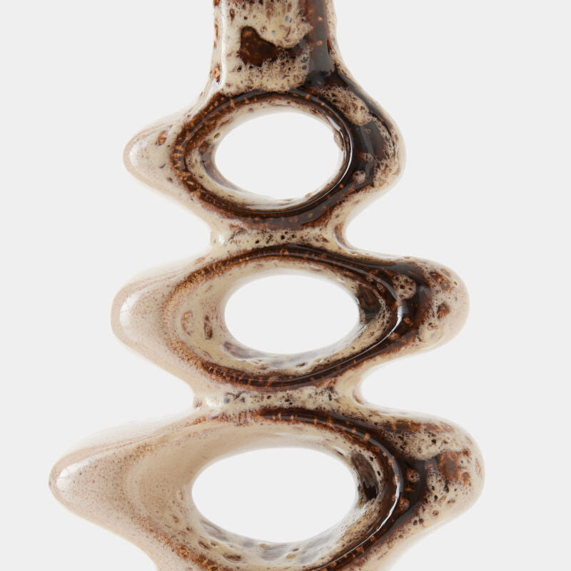 Close-up of a ceramic vase with textured surface on a white background