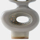 A close-up of a ceramic vase with a glossy taupe-gray finish and brown speckled glaze accents, showing a central loop opening and a flared base on a light gray background.