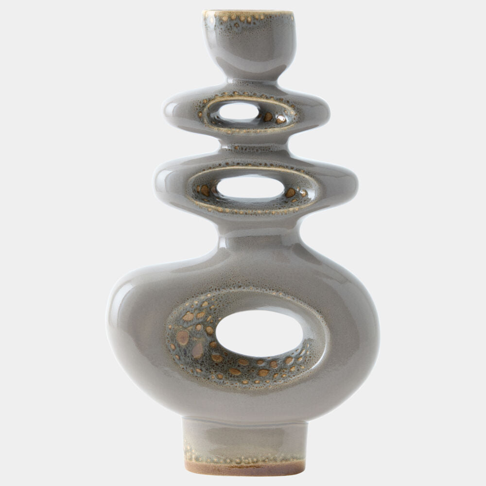 A modern ceramic sculpture vase with a stacked, organic shape and a glossy gray glaze accented by metallic gold speckles, set against a plain light gray background.