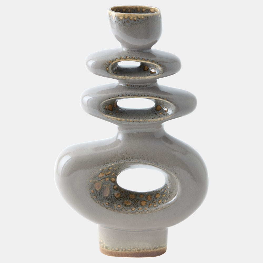 A modern stacked ceramic vase with a glossy gray glaze and metallic gold speckled accents inside the circular cutouts, set against a plain light gray background.