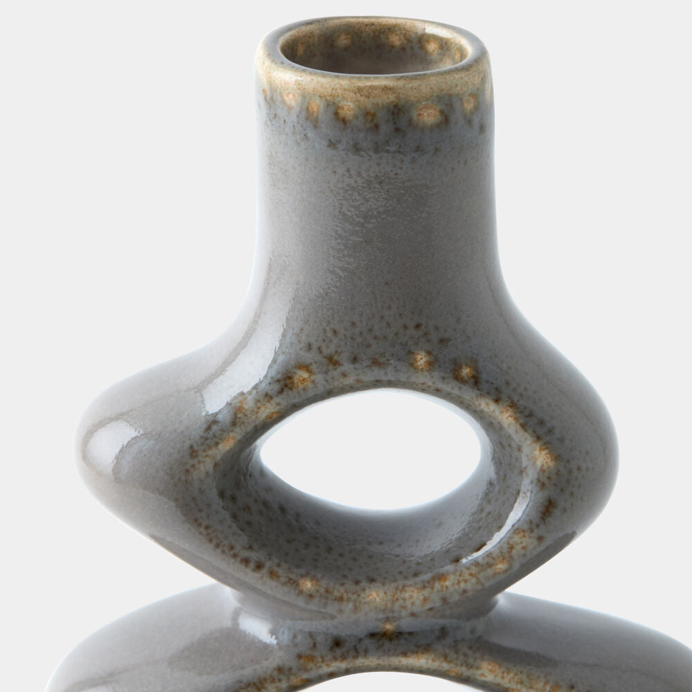 Close-up of a ceramic vase with a bulbous base and a narrow cylindrical neck, featuring a glossy gray-blue glaze with brown speckled accents, on a light gray background.