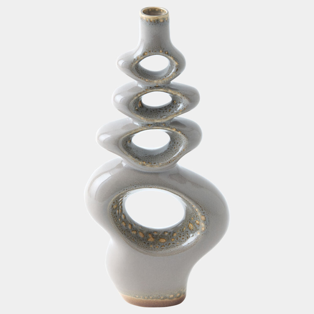 A modern abstract ceramic vase with a glossy light gray glaze and metallic gold speckled accents, set against a plain light gray background.