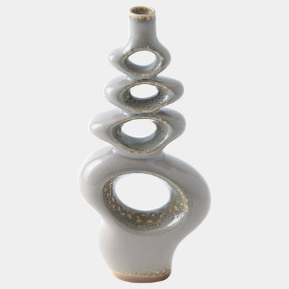 A modern abstract ceramic vase with a glossy light gray glaze and metallic gold speckled accents, set against a plain light gray background.