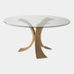 Glass dining table with bronze metal legs on a white background