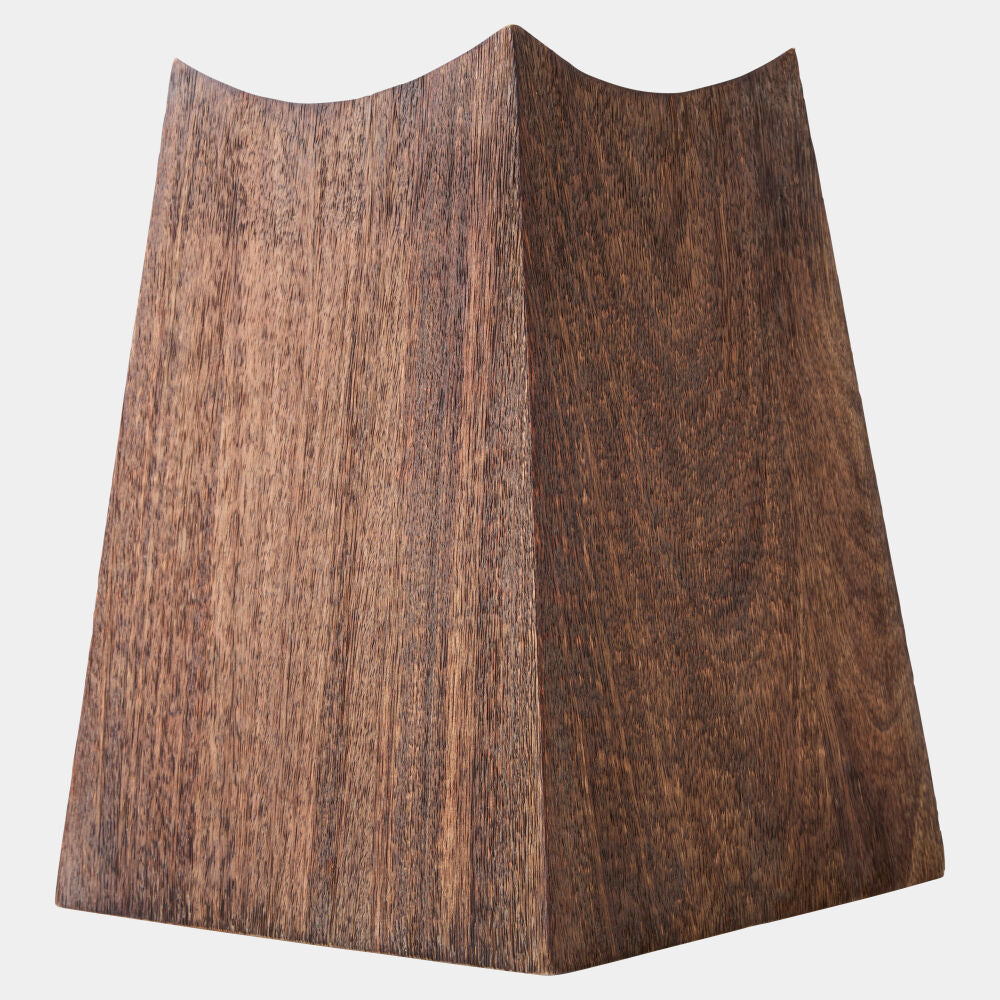 A triangular wooden panel or block with a prominent dark brown wood grain texture, shown against a plain light gray background.